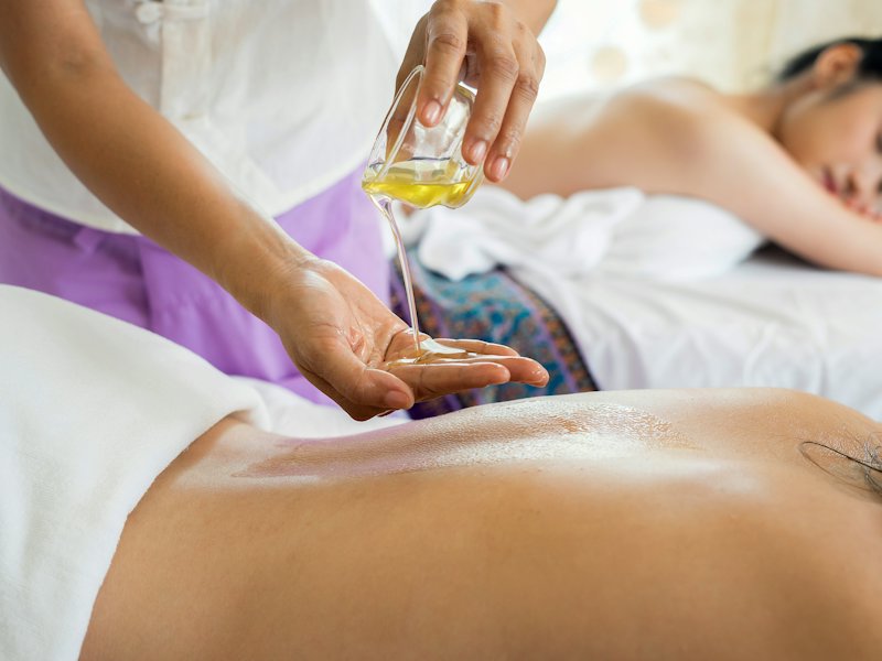 Massage treatment with warm oil